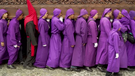 Purple-robed-priests-carry-coffins-in-a-colorful-Christian-Easter-celebration-in-Antigua-Guatemala