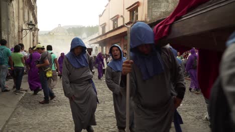 Purple-robed-priests-carry-Virgin-mary-statues-in-a-colorful-Christian-Easter-celebration-in-Antigua-Guatemala