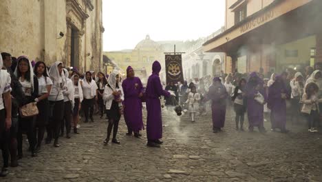 Robed-priests-carry-incense-burners-in-a-colorful-Christian-Easter-celebration-in-Antigua-Guatemala