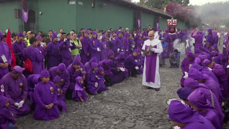 Purple-robed-priests-pray-in-a-colorful-Christian-Easter-celebration-in-Antigua-Guatemala