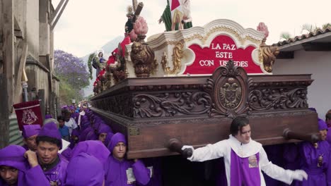 Purple-robed-priests-carry-giant-coffins-in-a-colorful-Christian-Easter-celebration-in-Antigua-Guatemala