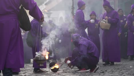 Purple-robed-priests-carry-incense-burners-in-a-colorful-Christian-Easter-celebration-in-Antigua-Guatemala-1