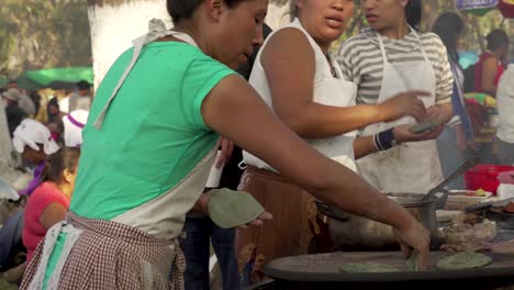 Women-prepare-food-at-a-Guatemala-street-market-stall