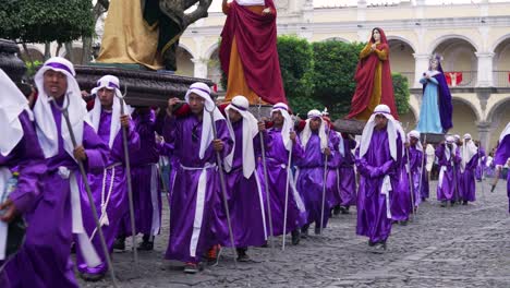 Robed-priests-carry-giant-statues-in-a-colorful-Christian-Easter-celebration-in-Antigua-Guatemala