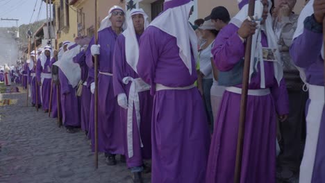 Purple-robed-Catholic-Christian-priests-march-in-the-Semana-Santa-Easter-week-holidays-in-Antigua-Guatemala