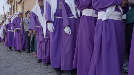 Purple-robed-Catholic-Christian-priests-march-in-the-Semana-Santa-Easter-week-holidays-in-Antigua-Guatemala-1