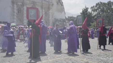 Purple-robed-Catholic-Christian-priests-cucaruchos-perform-in-the-Semana-Santa-Easter-week-holidays-in-Antigua-Guatemala-1