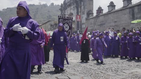 Purple-robed-Catholic-Christian-priests-march-in-the-Semana-Santa-Easter-week-holidays-in-Antigua-Guatemala-2