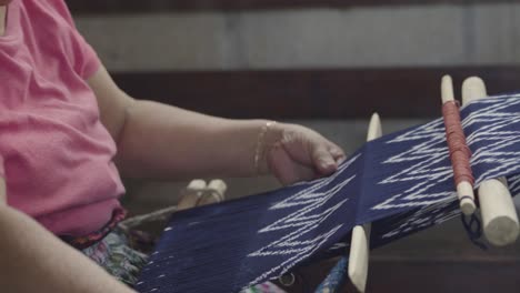 A-Maya-woman-weaves-using-a-traditional-loom-in-Guatemala-2