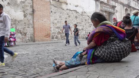 An-elderly-Maya-woman-passes-time-on-the-street-in-Antigua-Guatemala