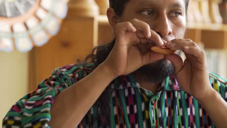 Beautiful-closeup-of-a-young-Mayan-musician-playing-a-traditional-flute