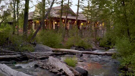 A-rushing-stream-and-the-club-house-at-the-Rock-Creek-Cattle-Company-in-Montana