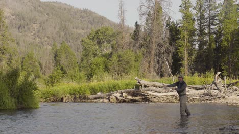 A-fly-fisherman-casting-on-a-quiet-trout-stream-in-Central-Montana