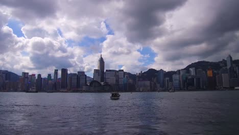 Panning-shot-across-Hong-Kong-harbor-and-skyline-with-clouds
