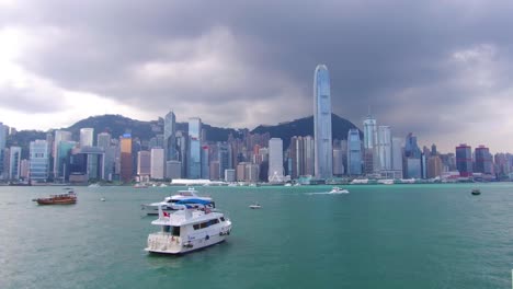Establishing-shot-across-Hong-Kong-harbor-and-skyline-with-clouds