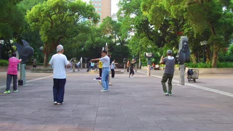 Chinese-seniors-practice-tai-chi-in-a-park-in-the-early-morning-in-Hong-Kong-China-2