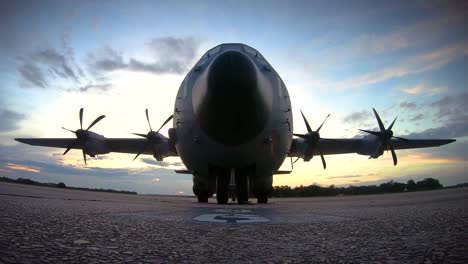 Good-Time-Lapse-Of-Clouds-Moving-Behind-A-C130-Hercules-Military-Airplane