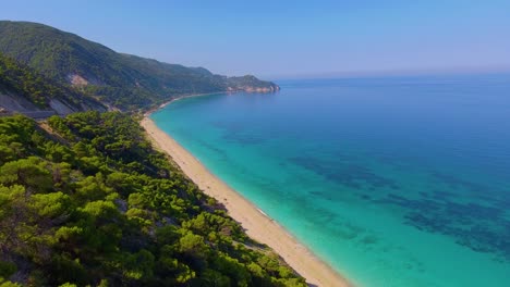 Aerial-over-beautiful-blue-Mediterranean-ocean-waters-reveals-Greek-Island-of-Lefkada-1