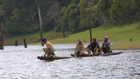 Men-paddle-a-canoe-across-Lake-Periyar-in-Kerala-India