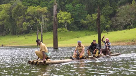 Men-paddle-a-canoe-across-Lake-Periyar-in-Kerala-India-1
