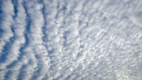 Time-lapse-shot-of-white-altocumulus-clouds-passing-overhead-1