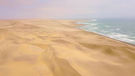 Good-aerial-above-a-road-and-sand-dunes-near-a-coastal-road-on-the-Skeleton-Coast-of-Namibia