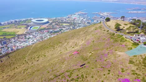Drone-aerial-over-paragliding-and-paragliders-with-the-downtown-city-of-Cape-Town-South-Africa-in-background-4