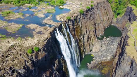 Beautiful-aerial-shot-of-majestic-Victoria-Falls-on-the-Zambezi-River-on-the-border-of-Zimbabwe-and-Zambia-inspiration-of-Africa-1