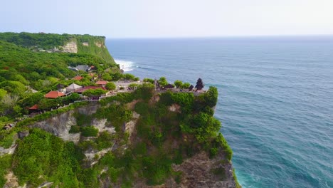 Aerial-over-the-beautiful-Hindu-temple-Tanah-Lot-perched-on-a-cliff-in-Bali-Indonesia