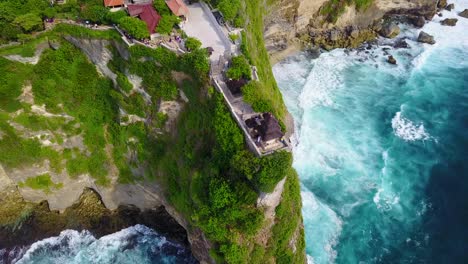 Aerial-over-the-beautiful-Hindu-temple-Tanah-Lot-perched-on-a-cliff-in-Bali-Indonesia-1