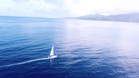 Beautiful-aerial-of-a-sailboat-sailing-across-the-Caribbean-ocean-sea-near-the-island-of-St-Lucia-2