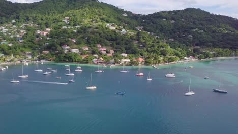 Aerial-establishing-shot-of-the-Caribbean-Island-of-St-Vincent-with-blue-bay-yachts-hotels-resorts-condos-and-luxury-homes