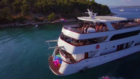 Swimmers-and-partiers-jump-off-a-large-yacht-or-boat-in-the-Adriatic-Sea-near-Croatia