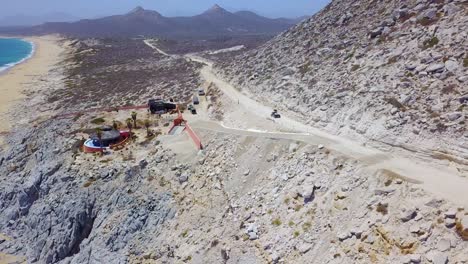 Good-aerial-of-an-ATV-speeding-on-a-dirt-road-near-Cabo-Baja-Mexico