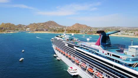 Huge-cruise-ship-aerial-shot-off-coast-Cabo-San-Lucas-Baja-California-Mexico-hotels-and-resorts-along-coast