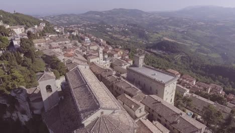 Aerial-over-prepublic-of-San-Marino-hillsides-and-villages-of-Monte-Titano