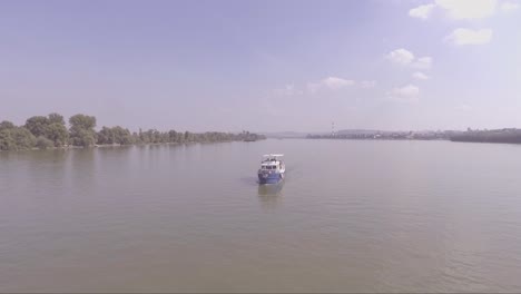 Aerial-of-a-boat-traveling-on-the-Danube-or-Sava-River-near-Belgrade-Serbia-1
