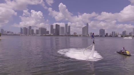 A-man-hovers-using-a-water-jetpack-flyboard-on-the-ocean-in-Miami-Florida