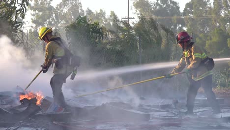 Ground-Fire-Burns-As-Firefighters-Battle-A-Burning-Structure-During-The-Easy-Fire-Wildfire-Disaster-In-The-Hills-Near-Simi-Valley-Southern-California-2
