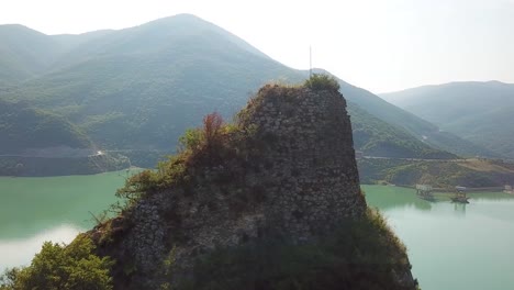 Aerial-Around-An-Abandoned-Ruin-On-Lake-Zhinvali-In-The-Republic-Of-Georgia