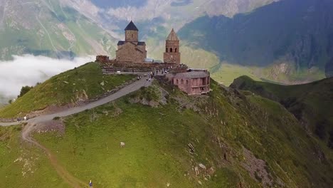 Aerial-Approaching-The-Gergeti-Monastery-And-Church-Overlooking-The-Caucasus-Mountains-In-The-Republic-Of-Georgia-1