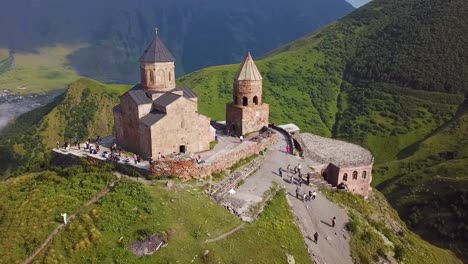 Aerial-Around-The-Gergeti-Monastery-And-Church-Overlooking-The-Caucasus-Mountains-In-The-Republic-Of-Georgia