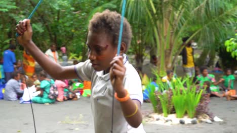 A-Boy-With-Painted-Face-Walks-In-Slow-Motion-Smiling-At-A-School-In-Port-Vila-Vanuatu
