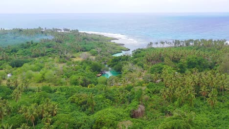 Good-Aerial-Establishing-Shot-Of-A-Remote-Swimming-Hole-And-Small-Hotel-On-The-Pacific-Island-Of-Vanuatu-Melanesia