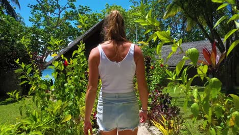 Pov-Following-A-Young-Tourist-Woman-From-Behind-To-A-Hotel-Or-Hut-Resort-On-Vanuatu-Pacific-Islands-Melanesia