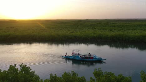 Beautiful-Aerial-Over-Small-Boat-Moving-Along-The-Gambia-River-In-West-Africa-Through-Mangrove-Forests-And-Winding-Bends-1