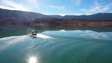Aerial-Over-Pontoon-Tourist-Boat-On-Lake-Bin-El-Ouidane-Morocco