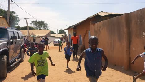 Niños-Run-In-Slow-Motion-On-A-Dirt-Road-In-West-Africa