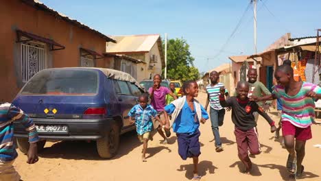 Children-Run-In-Slow-Motion-On-A-Dirt-Road-In-West-Africa-1