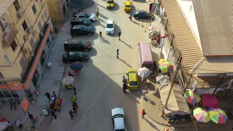 Very-Good-Aerial-Over-West-African-Street-With-Skateboarders-In-Gambia-Passes-For-Guinea-Bissau-Sierra-Leone-Nigeria-Ivory-Coast-Or-Liberia